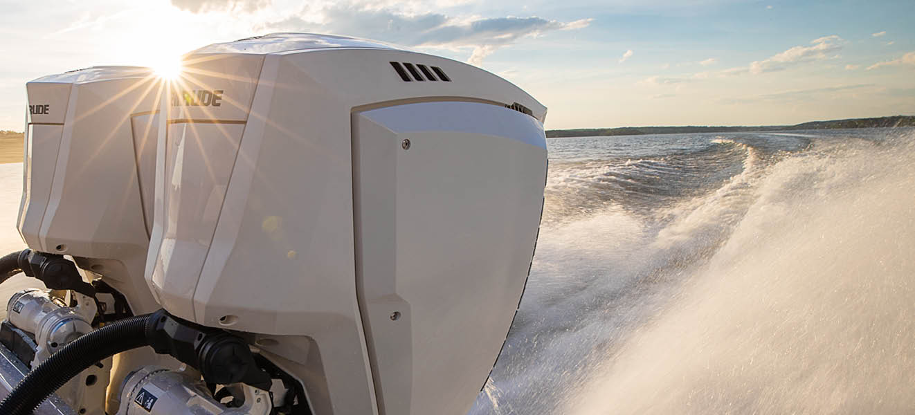 Two Evinrude outboard motors on a boat in action Two Evinrude outboard motors on a boat in action