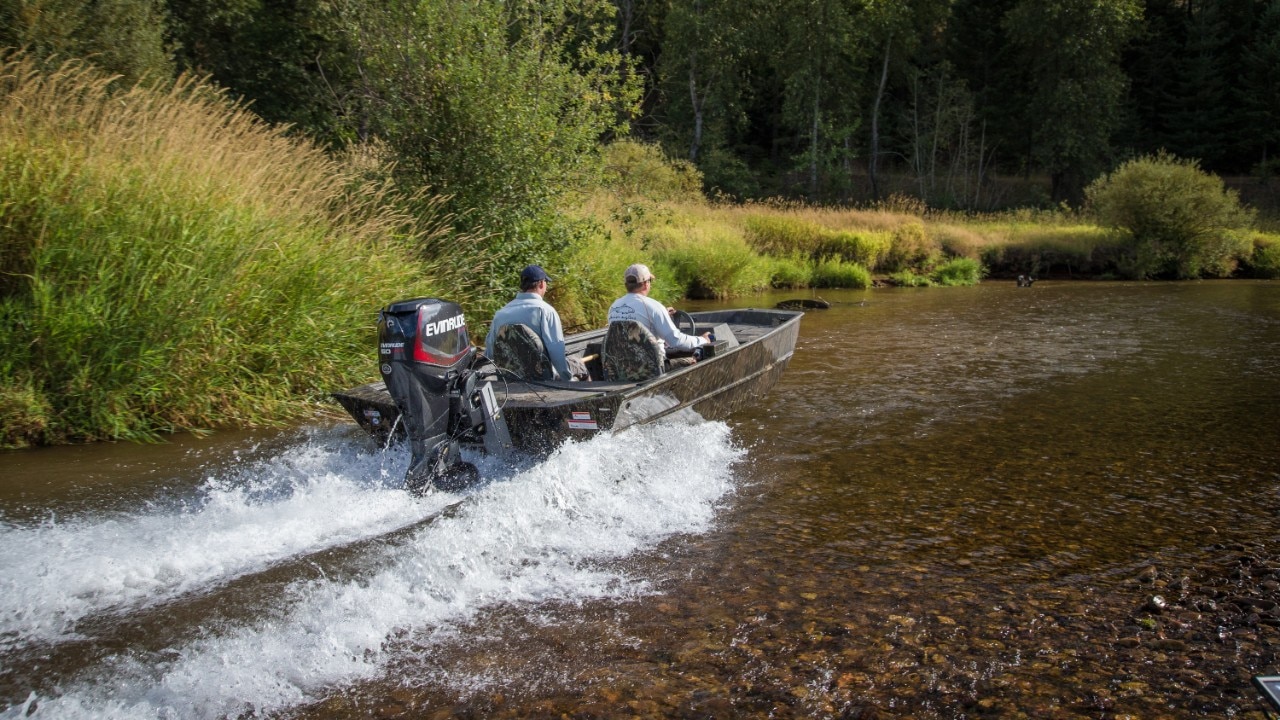 Aluminium fishing boat powered by Evinrude Outboard motor Aluminium fishing boat powered by Evinrude Outboard motor